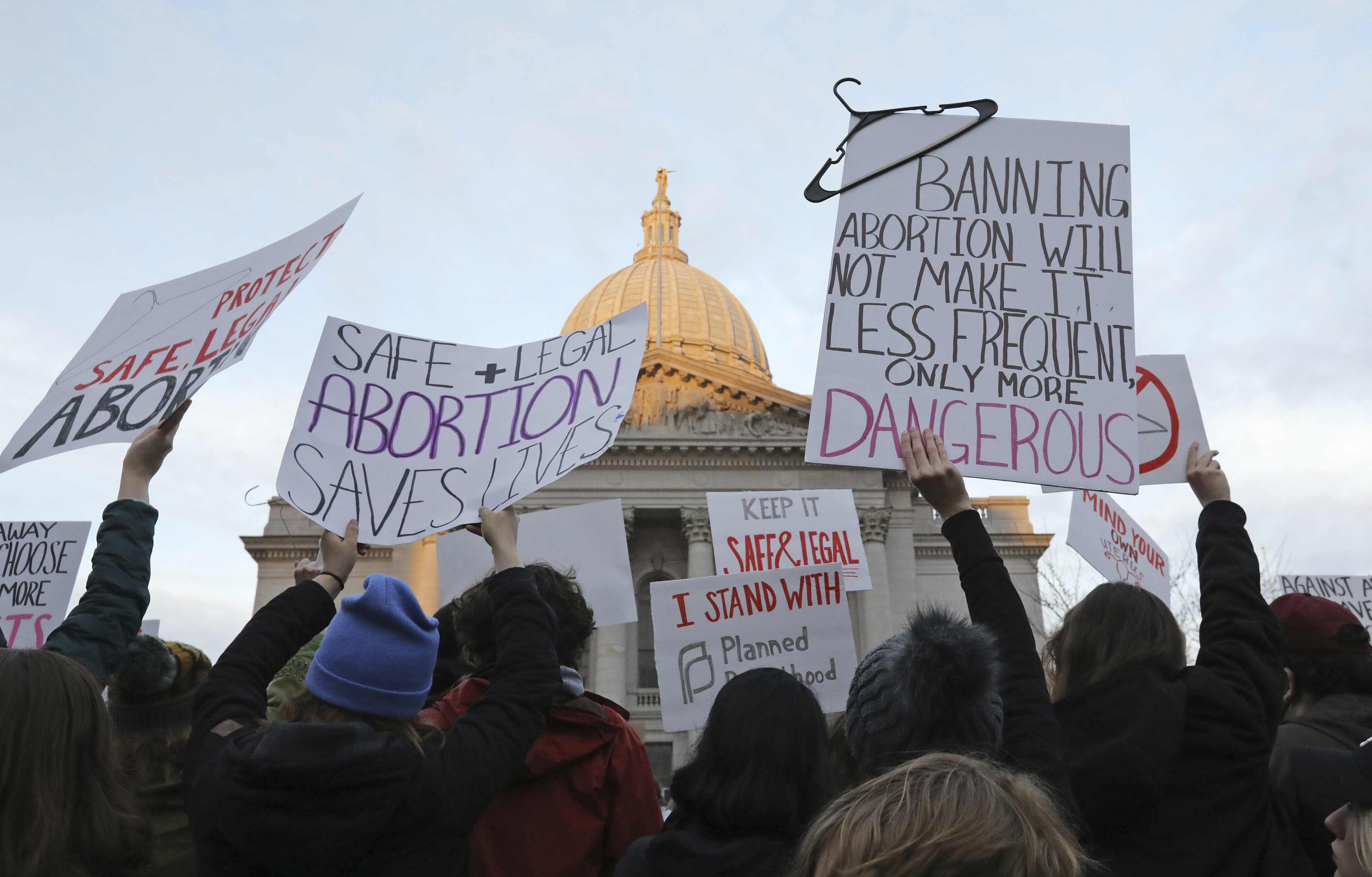 FILE - Demonstrators protest outside the state Capitol in Madison, Wis., on May 3, 2022, in response to the news that the U.S. Supreme Court could be poised to overturn the landmark Roe v. Wade case that legalized abortion nationwide. A Wisconsin judge is set to consider Thursday, May 4, 2023, whether the state's attorney general can legally challenge the battleground state's 174-year-old abortion ban and whether the ban is so old its unenforceable. (Amber Arnold/Wisconsin State Journal via AP, File)