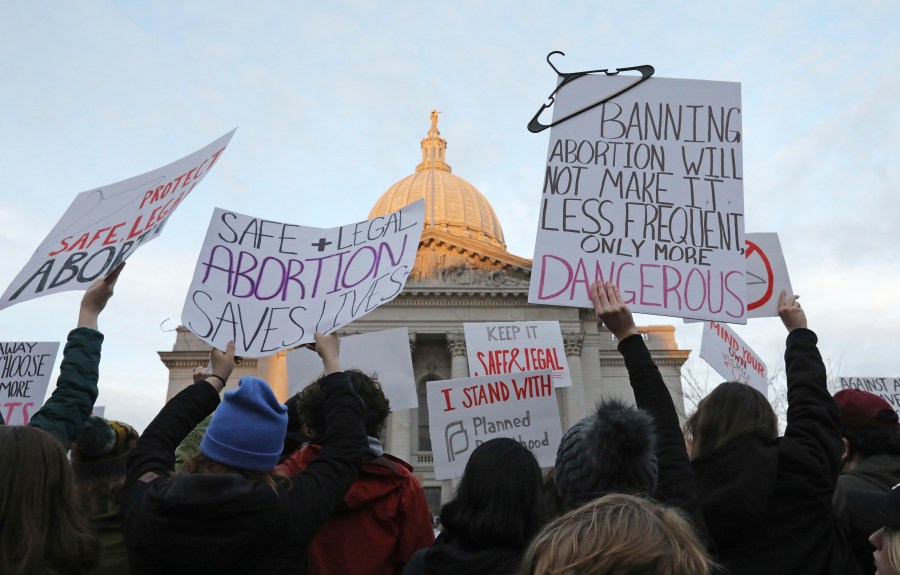 FILE - Demonstrators protest outside the state Capitol in Madison, Wis., on May 3, 2022, in response to the news that the U.S. Supreme Court could be poised to overturn the landmark Roe v. Wade case that legalized abortion nationwide. A Wisconsin judge is set to consider Thursday, May 4, 2023, whether the state's attorney general can legally challenge the battleground state's 174-year-old abortion ban and whether the ban is so old its unenforceable. (Amber Arnold/Wisconsin State Journal via AP, File)