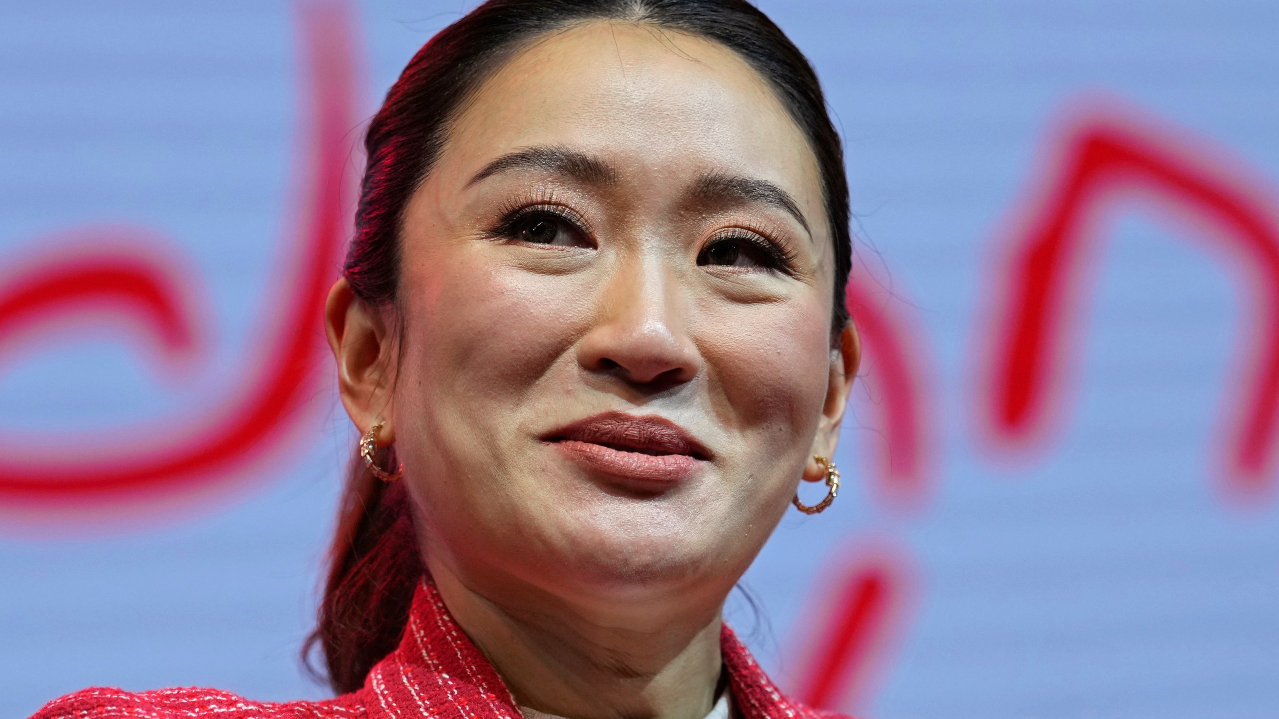 Paetongtarn Shinawatra, a leader of Thailand's opposition Pheu Thai Party, smiles as she talks to reporters at Thammasat University’s indoor gymnasium in Pathum Thani province, north of Bangkok, Thailand, on Friday, March 17, 2023. The Pheu Thai Party is heavily favored to win the most seats in the May 14 general election, and Paetongtarn, daughter of former Prime Minister Thaksin Shinawatra, is one of its three nominees to become the next prime minister. (AP Photo/Sakchai Lalit)