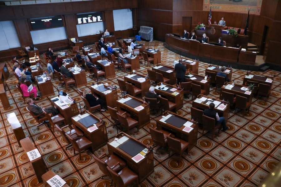 Senators sit at their desks during a session at the Oregon State Capitol in Salem, Ore., Thursday, May 4, 2023. Four Republican senators and one Independent senator had unexcused absences, preventing a quorum for the second day. (AP Photo/Amanda Loman)