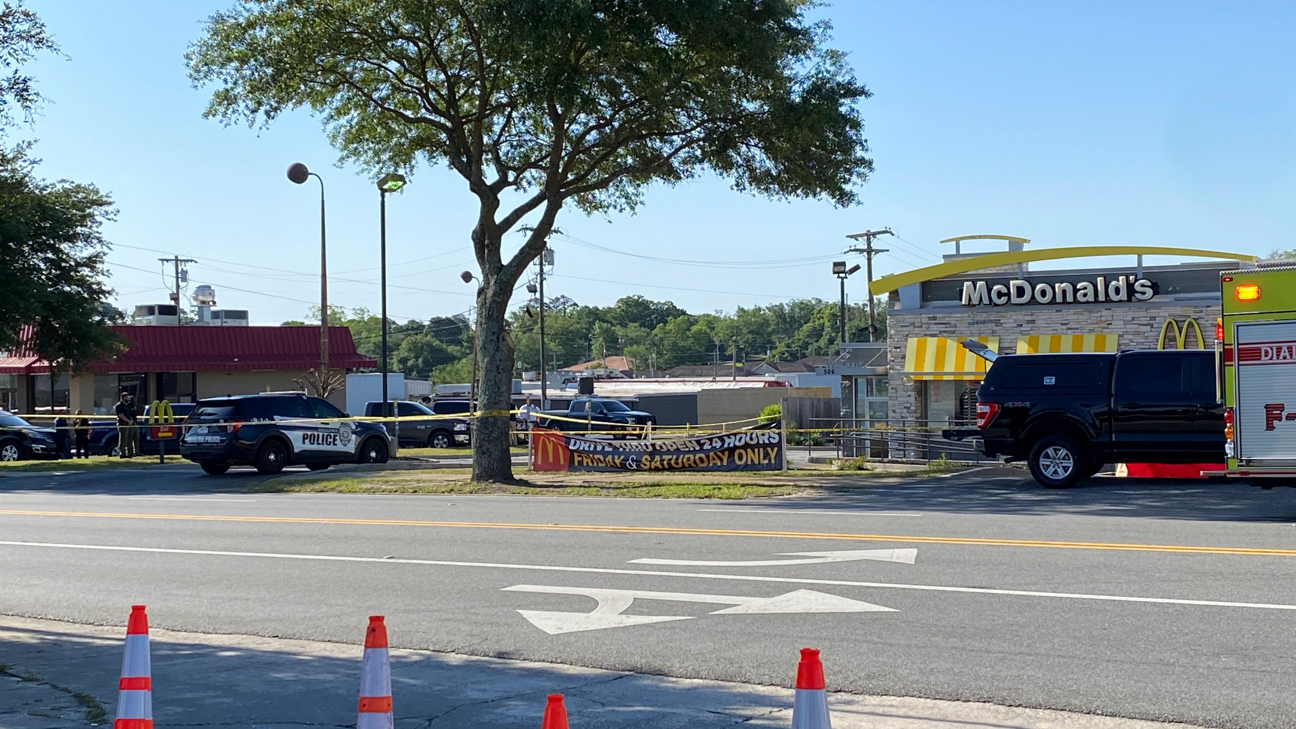 Police vehicles sit parked in front of a McDonald's restaurant as police investigate a shooting in which multiple people were killed Thursday, May 4, 2023, in Moultrie, Ga. The Georgia Bureau of Investigation said Thursday that there is more than one crime scene, including one at the McDonald’s restaurant. (Kamira Smith/The Moultrie Observer via AP)