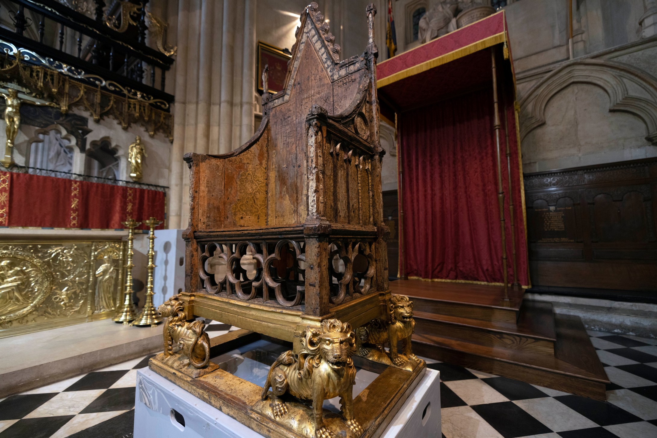 FILE - The Coronation Chair is seen inside Westminster Abbey in London, Wednesday, April 12, 2023, ahead of King Charles III coronation on May 6, 2023. The crown will be placed on Charles’ head as he sits in the Coronation Chair suspended over the Stone of Scone (pronounced “scoon”) — the sacred slab of sandstone on which Scottish kings were crowned. The chair has been part of every coronation since 1308. (Dan Kitwood/Pool Photo via AP, file)