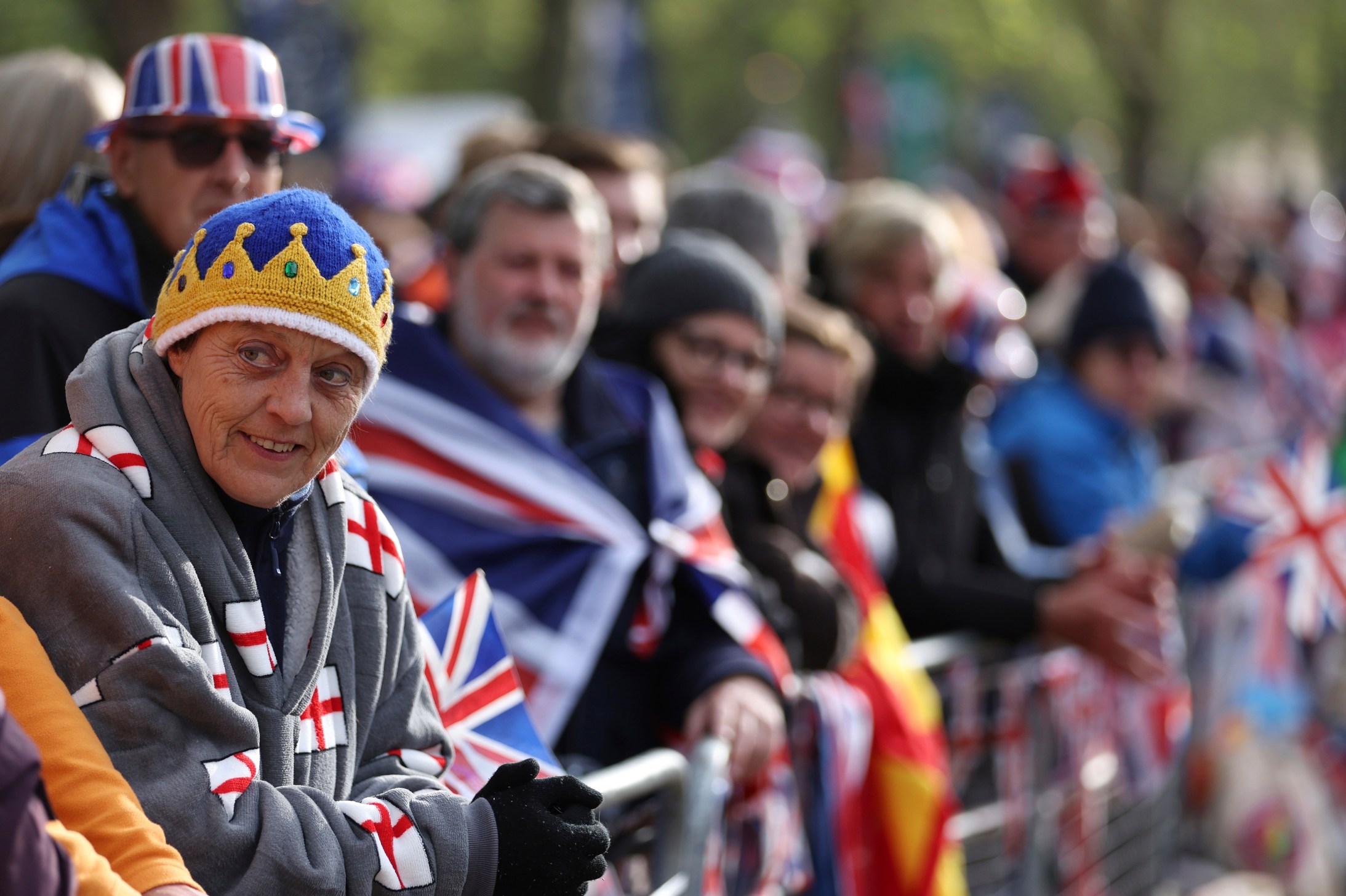 Members of the public gather near Parliament Square ahead of the Coronation of King Charles III, in London, Saturay, May 6, 2023. (Richard Heathcote, Pool via AP)