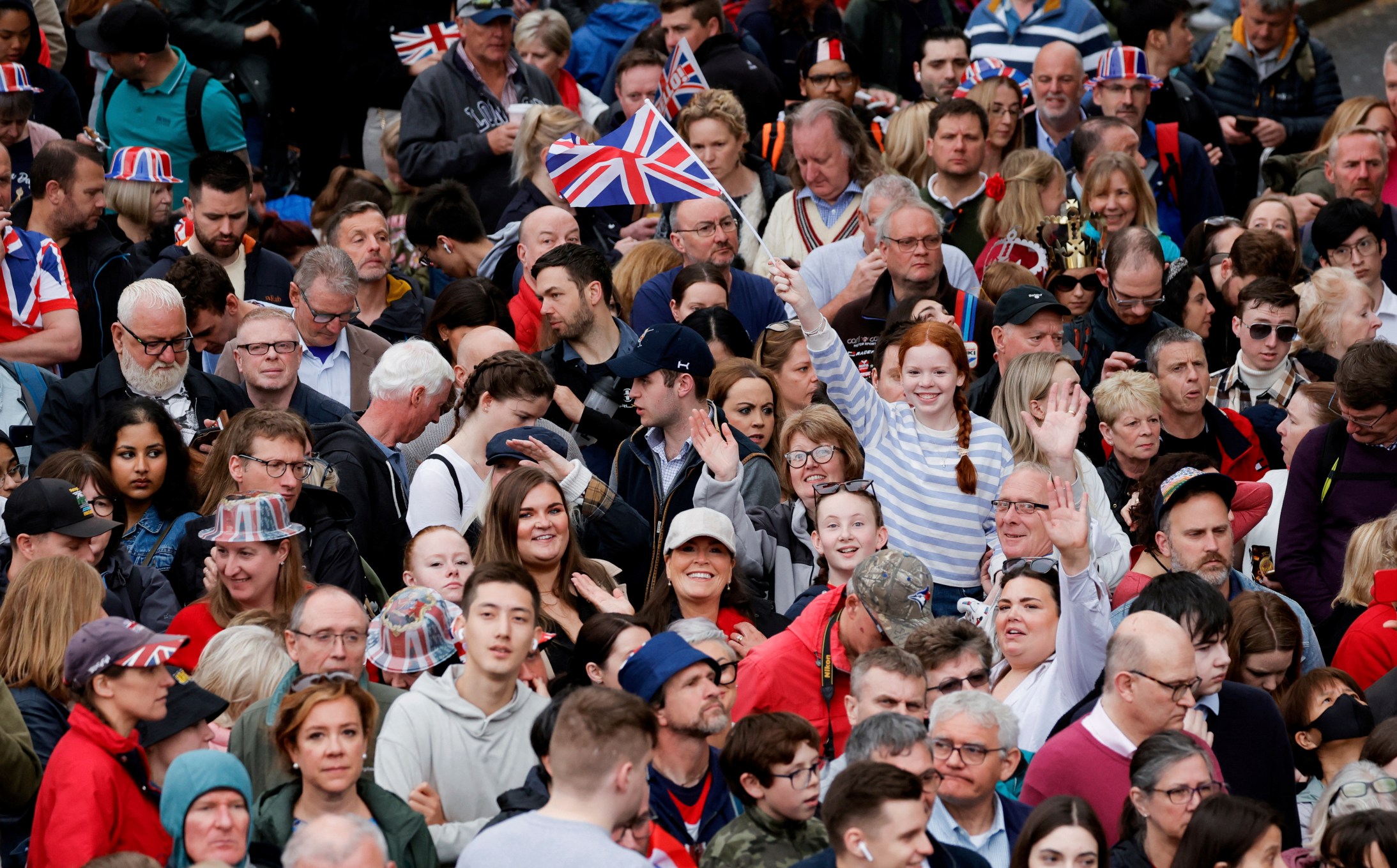 People gather ahead of the Coronation of Britain's King Charles III in London, Saturday, May 6, 2023. (Piroschka van de Wouw/Pool via AP)