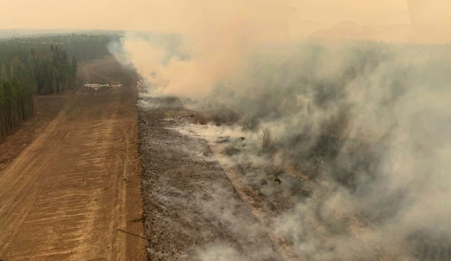 In this photo provided by the Government of Alberta Fire Service, a burned section of forest in the area near Edson, Alberta, smolders, Saturday, May 6, 2023. (Government of Alberta Fire Service/The Canadian Press via AP)