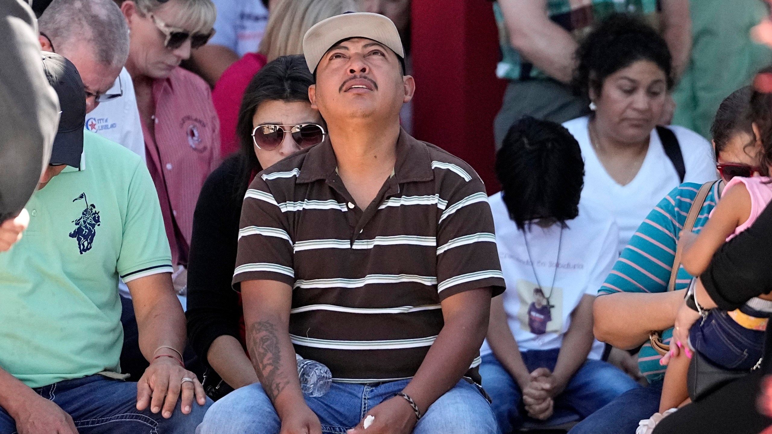 Mass shooting survivor Wilson Garcia looks up to the sky during a vigil for his son, Daniel Enrique Laso, 9, Sunday, April 30, 2023, in Cleveland, Texas. Garcia's son and wife were among the five people killed in a mass shooting last week when the suspected gunman, Francisco Oropeza, allegedly shot his neighbors after they asked him to stop firing off rounds in his yard. (AP Photo/David J. Phillip)