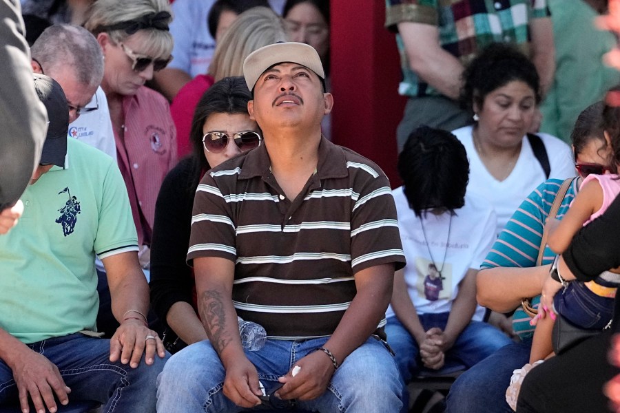 Mass shooting survivor Wilson Garcia looks up to the sky during a vigil for his son, Daniel Enrique Laso, 9, Sunday, April 30, 2023, in Cleveland, Texas. Garcia's son and wife were among the five people killed in a mass shooting last week when the suspected gunman, Francisco Oropeza, allegedly shot his neighbors after they asked him to stop firing off rounds in his yard. (AP Photo/David J. Phillip)