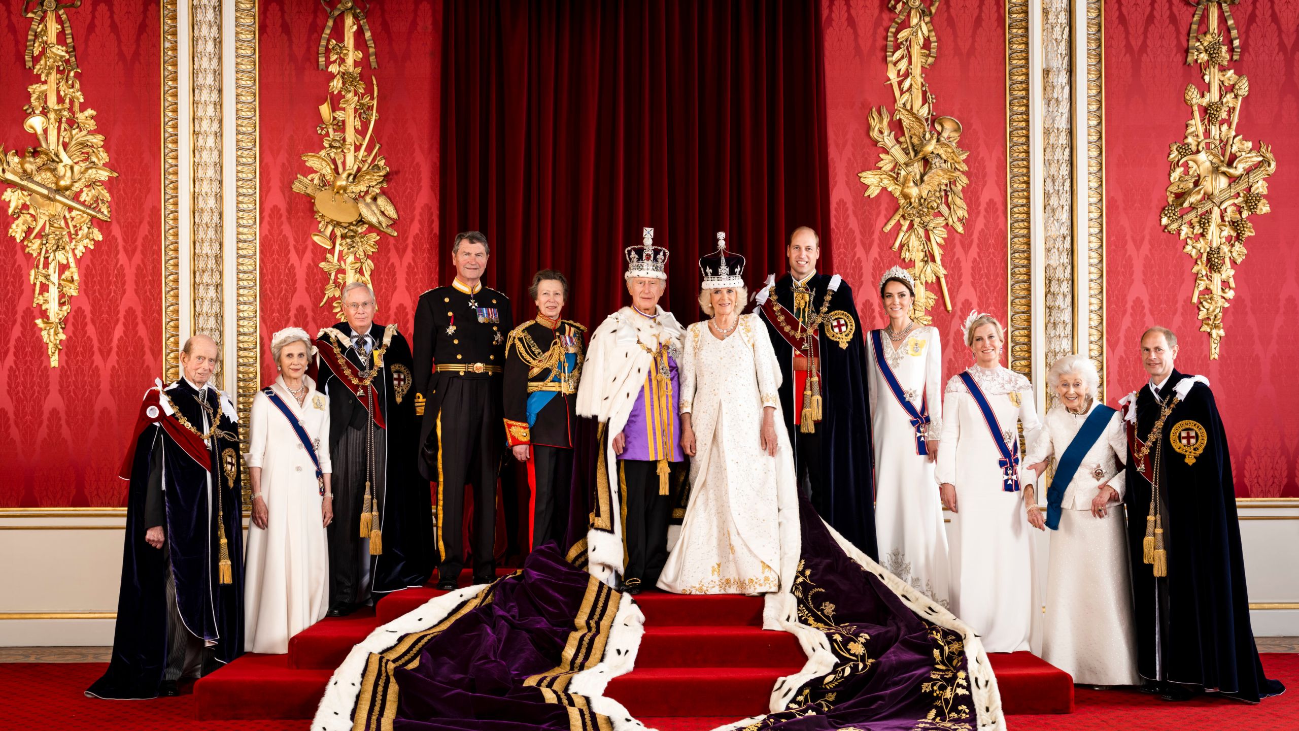 In this photo made available by Buckingham Palace on Monday, May 8, 2023, Britain's King Charles III and Queen Camilla are pictured with members of the working royal family, from left Prince Edward, the Duke of Kent, Birgitte, Duchess of Gloucester, Prince Richard, the Duke of Gloucester, Vice Admiral Sir Tim Laurence, Princess Anne, Prince William, the Prince of Wales, Kate, the Princess of Wales, Sophie, the Duchess of Edinburgh, Princess Alexandra, the Hon. Lady Ogilvy and Prince Edward, the Duke of Edinburgh, in the Throne Room at Buckingham Palace, London. (Hugo Burnand/Royal Household 2023 via AP)