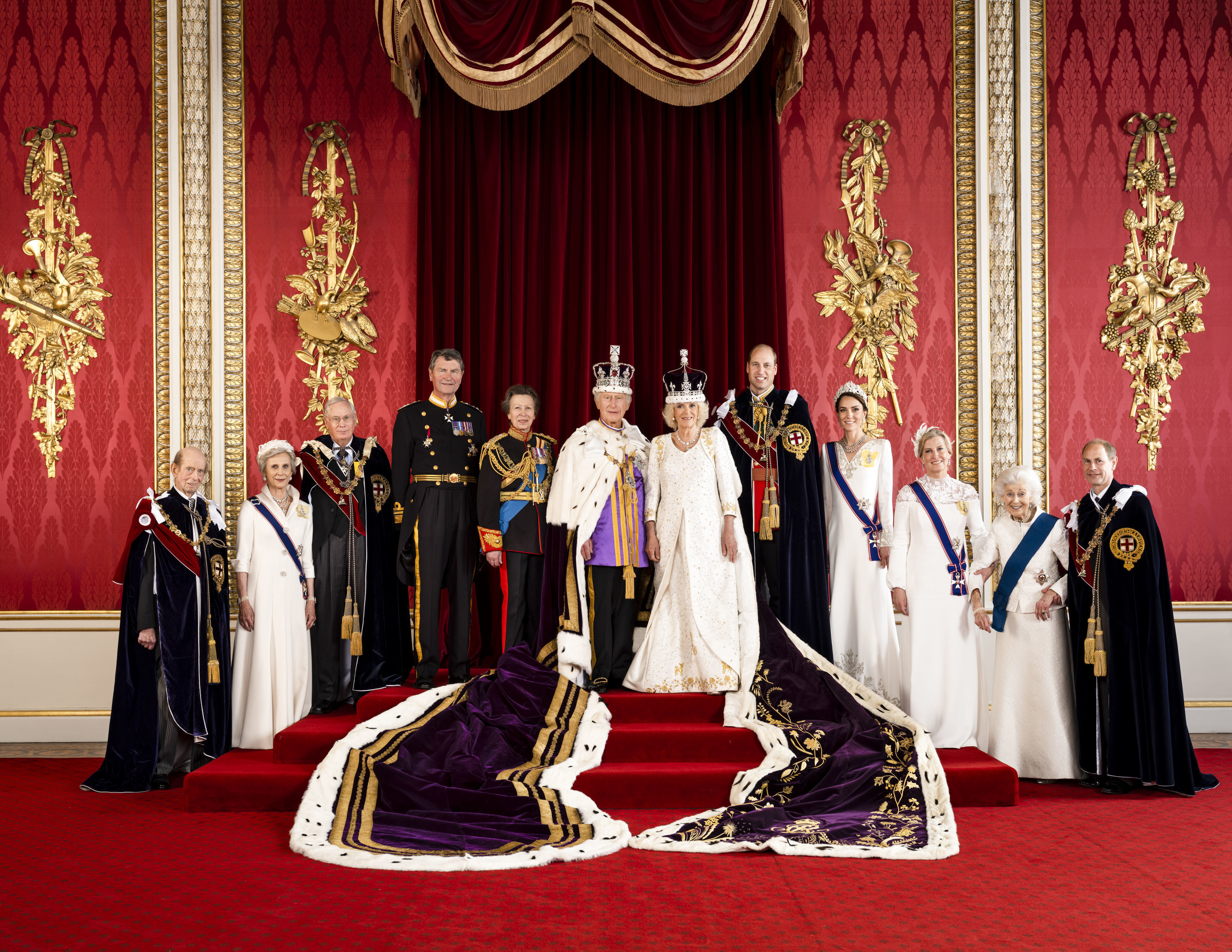 In this photo made available by Buckingham Palace on Monday, May 8, 2023, Britain's King Charles III and Queen Camilla are pictured with members of the working royal family, from left Prince Edward, the Duke of Kent, Birgitte, Duchess of Gloucester, Prince Richard, the Duke of Gloucester, Vice Admiral Sir Tim Laurence, Princess Anne, Prince William, the Prince of Wales, Kate, the Princess of Wales, Sophie, the Duchess of Edinburgh, Princess Alexandra, the Hon. Lady Ogilvy and Prince Edward, the Duke of Edinburgh, in the Throne Room at Buckingham Palace, London. (Hugo Burnand/Royal Household 2023 via AP)