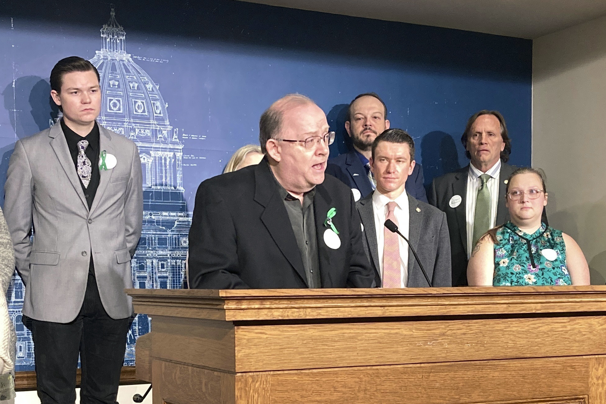 Michael Strande speaks at a news conference at the Minnesota State Capitol, Tuesday, May 9, 2023, in St. Paul, Minn., in support of state legislation to ban non-essential uses of "forever chemicals" also known as PFAS. The legislation is named after his daughter, Amara Strande, who spent the last months of her life campaigning for restrictions that will be some of the toughest in the country. Amara died two days shy of her 21st birthday last month from a rare form of liver cancer. (AP Photo/Steve Karnowski)