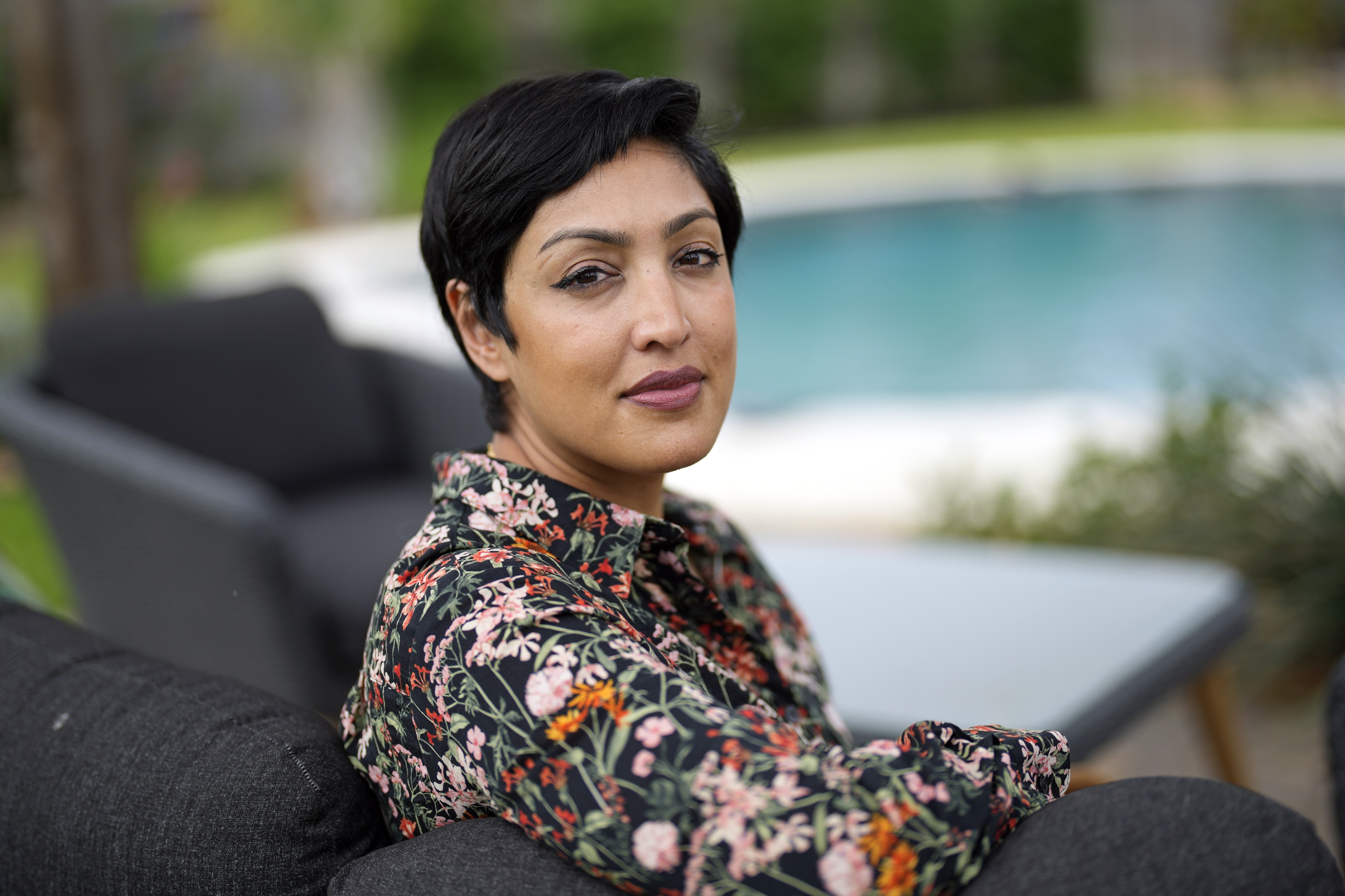 Rumman Chowdhury, co-founder of Humane Intelligence, a nonprofit developing accountable AI systems, poses for a photograph at her home Monday, May 8, 2023, in Katy, Texas. ChatGPT maker OpenAI, and other major AI providers such as Google and Microsoft, are coordinating with the Biden administration to let thousands of hackers take a shot at testing the limits of their technology. Chowdhury is the lead coordinator of the mass hacking event planned for this summer's DEF CON hacker convention in Las Vegas. (AP Photo/David J. Phillip)