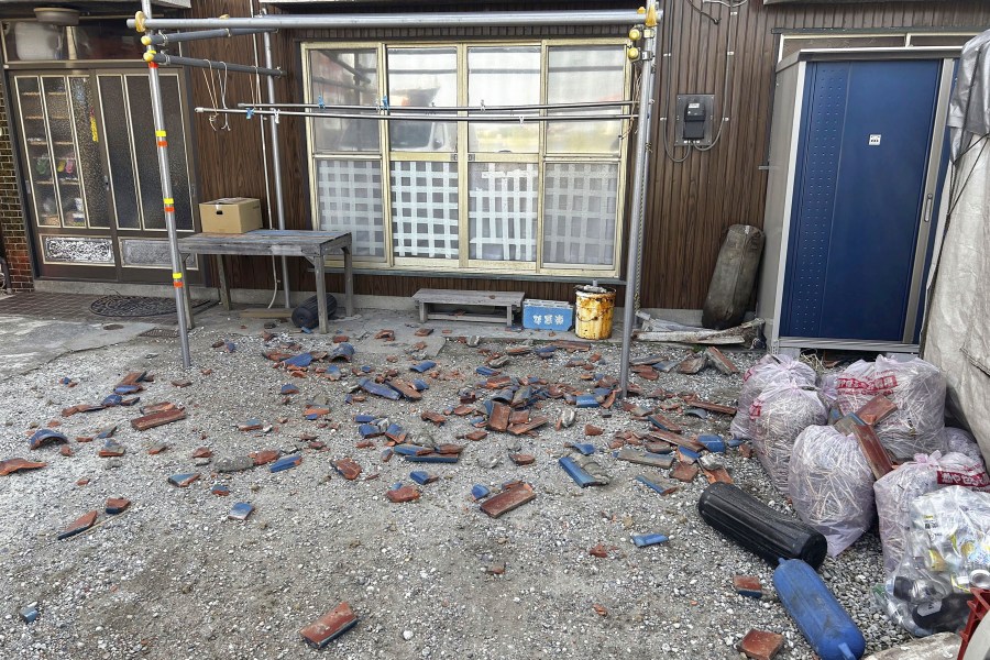 Tiles are scattered after an earthquake in Kisarazu, Chiba prefecture, near Tokyo Thursday, May 11, 2023. An earthquake shook Japan's capital, Tokyo, and surrounding areas on Thursday, injuring several people and causing minor damage, officials and media said. (Kyodo News via AP)