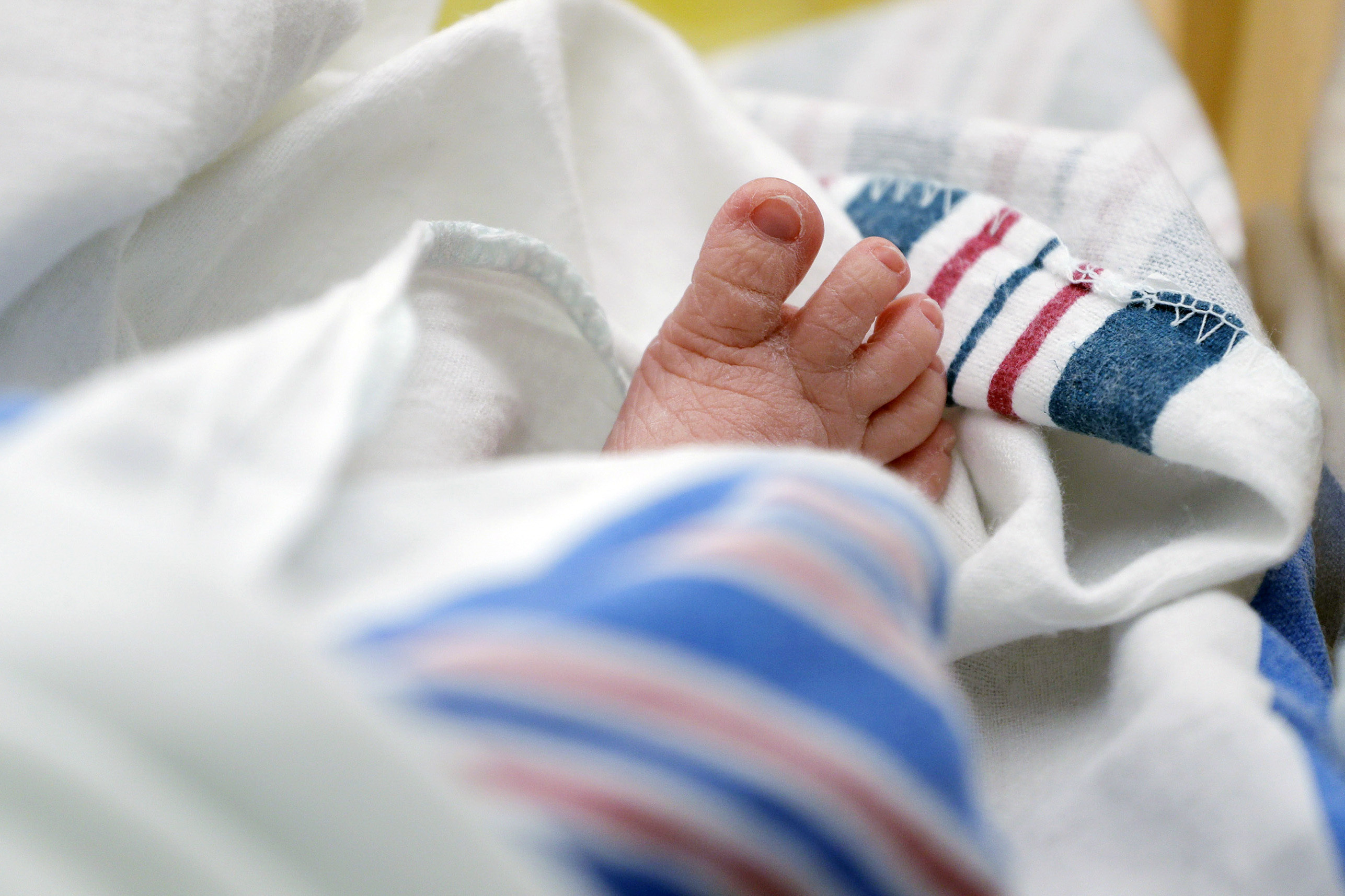 FILE - The toes of a baby are seen DHR Health, July 29, 2020, in McAllen, Texas. Dutton and Wrenlee are on the rise but they’re no match for champs Liam and Olivia as the top baby names in the U.S. last year. (AP Photo/Eric Gay, File)