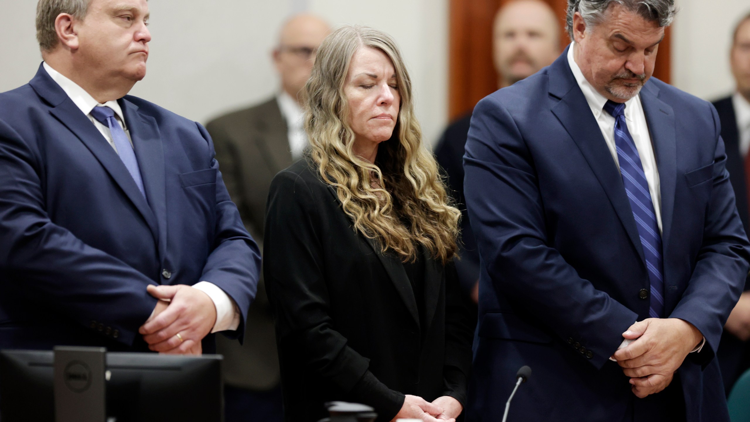 Lori Vallow Daybell stands and listens as the jury's verdict is read at the Ada County Courthouse in Boise, Idaho on Friday May 12, 2023. The Idaho jury convicted Daybell of murder in the deaths of her two youngest children and a romantic rival, a verdict that marks the end of a three-year investigation that included bizarre claims of zombie children, apocalyptic prophesies and illicit affairs. (AP Photo/Kyle Green)