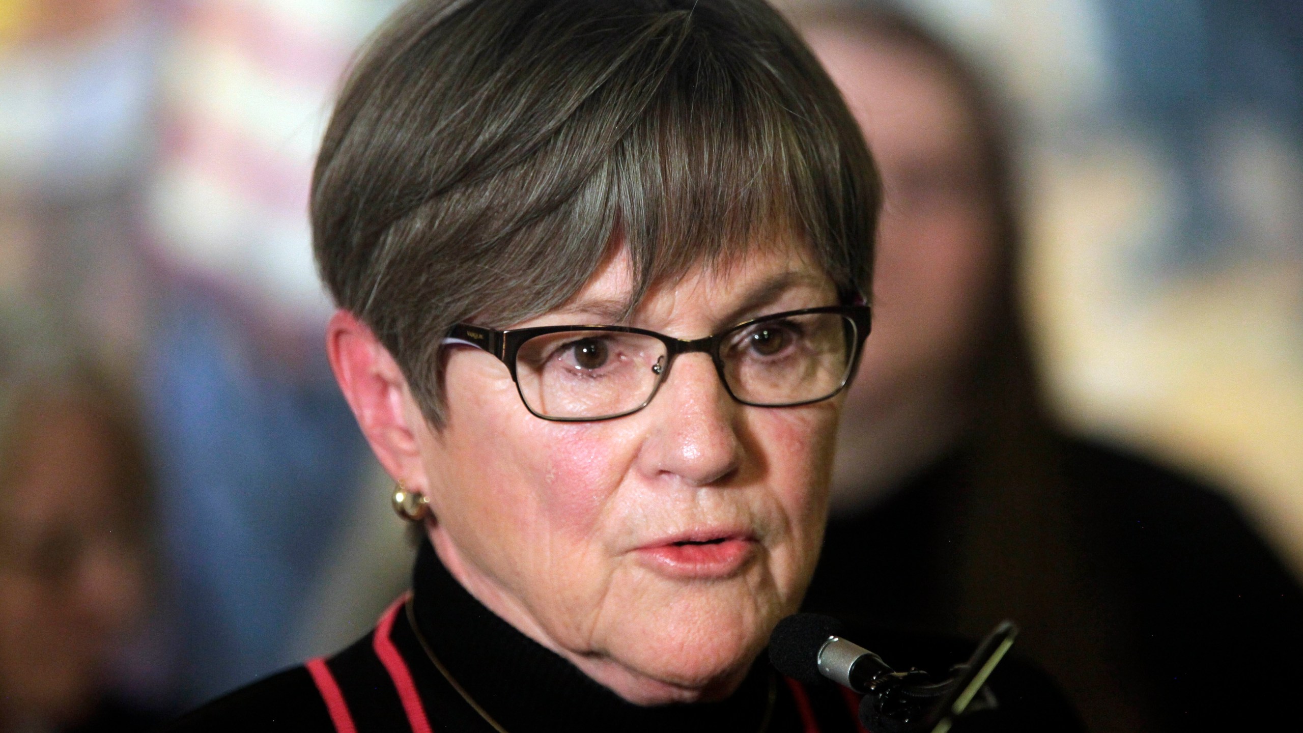 Kansas Gov. Laura Kelly speaks during a news conference with former Kansas Teacher of the Year winners, Tuesday, April 25, 2023, at the Statehouse in Topeka, Kan. As conservative Republican lawmakers promote school choice proposals, the Democratic governor says the state should not "divert" its tax dollars to private schools. (AP Photo/John Hanna)