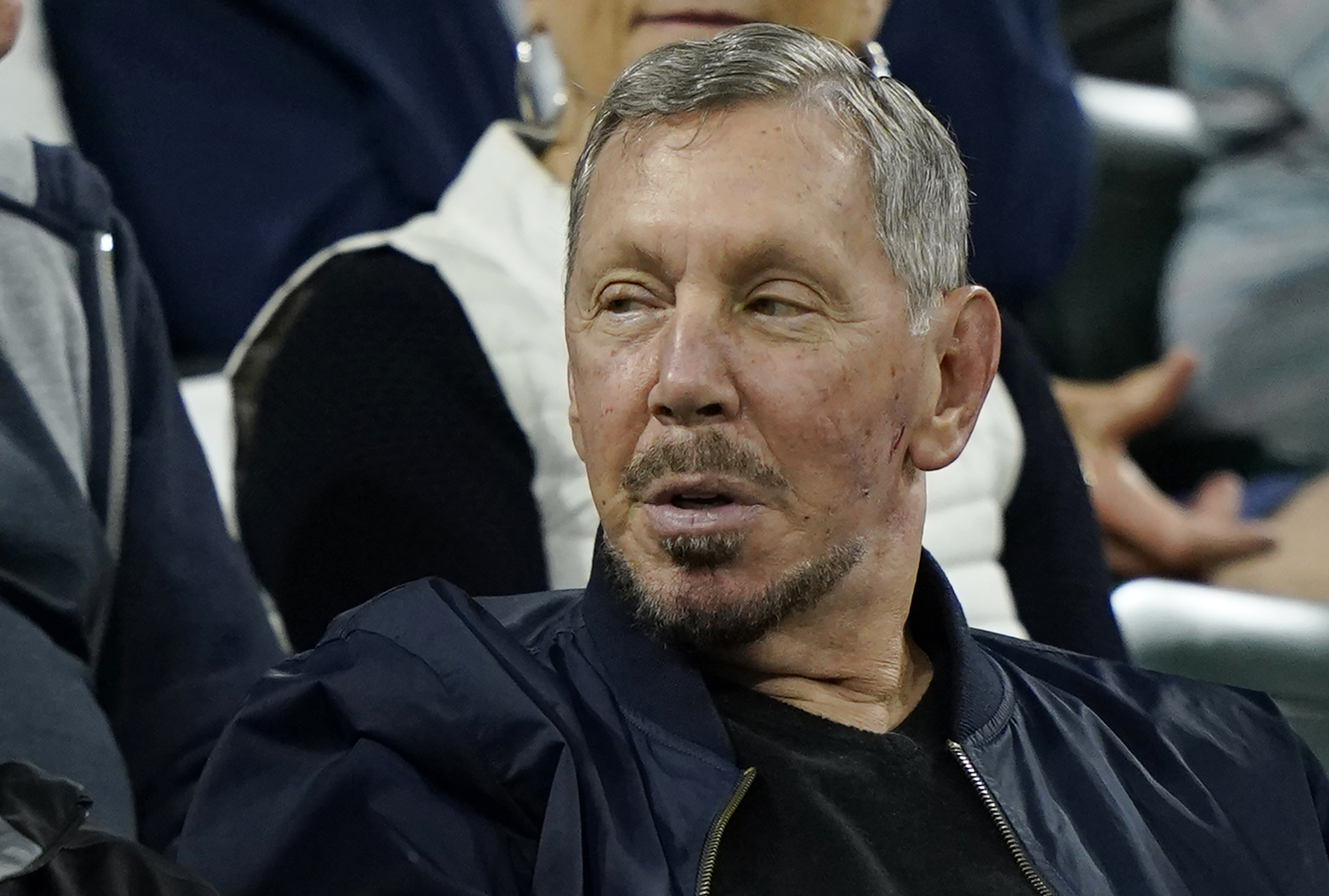 FILE - Larry Ellison, chairman of Oracle Corporation and chief technology officer, watches from the stands at the BNP Paribas Open tennis tournament Wednesday, Oct. 13, 2021, in Indian Wells, Calif. On Friday, May 12, 2023, a Delaware judge ruled in favor of Ellison in a shareholder lawsuit alleging that he coerced the technology’s company’s board into paying a grossly inflated price to acquire software company NetSuite Corp., in 2016. (AP Photo/Mark J. Terrill, File)