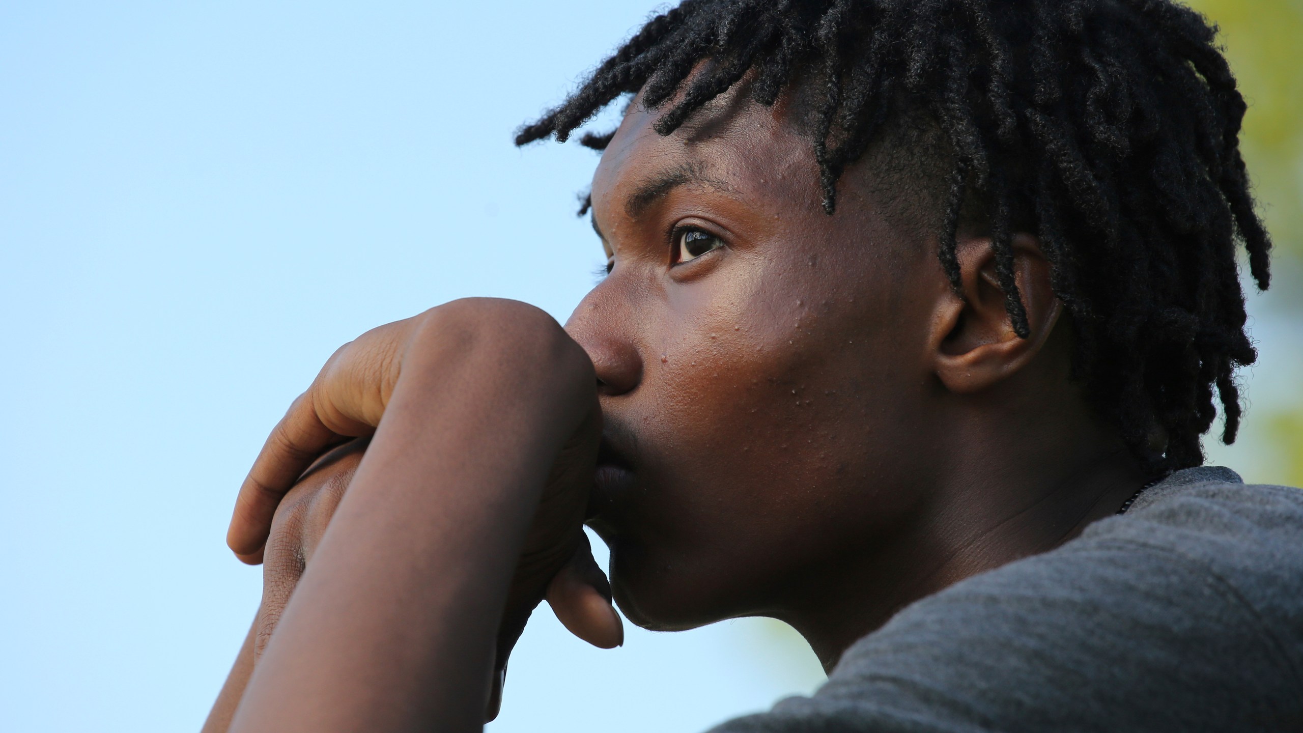 Jamari Shaw, 16, poses for a portrait in his East side neighborhood Thursday, May 11, 2023, in Buffalo, N.Y. Shaw is one of many young people who are still nervous in their surroundings since last years racist mass shooting at Tops Market. (AP Photo/Jeffrey T. Barnes)