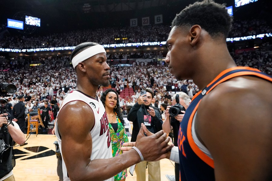 Miami Heat forward Jimmy Butler, left, and New York Knicks guard RJ Barrett congratulate each other after the Heat beat the Knicks 96-92 during Game 6 of an NBA basketball second-round playoff series, Friday, May 12, 2023, in Miami. (AP Photo/Wilfredo Lee)