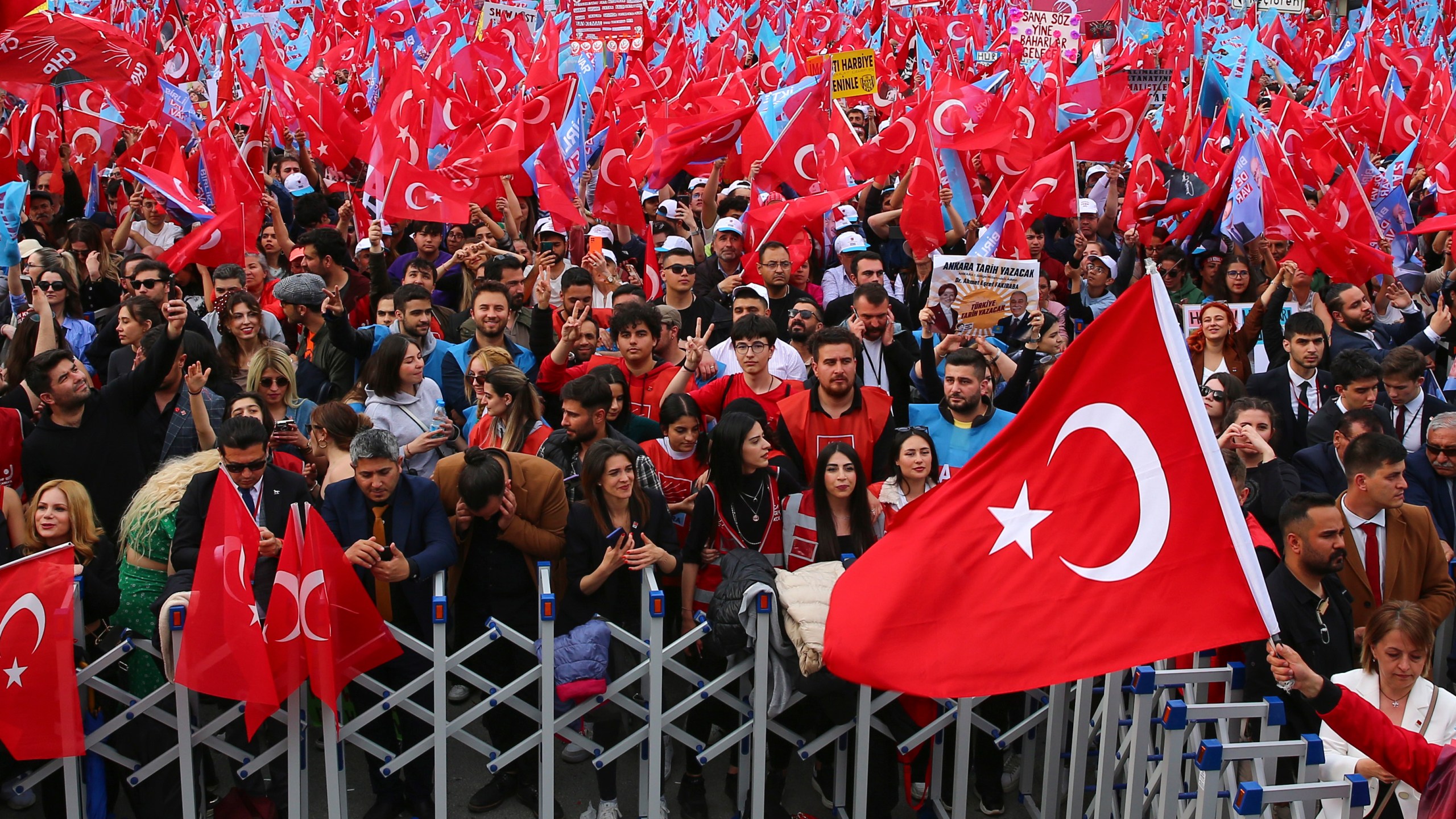 Supporters of Turkish CHP party leader and Nation Alliance's presidential candidate Kemal Kilicdaroglu wave Turkish flags during an election campaign rally in Ankara, Turkey, Friday, May 12, 2023. Turkey is heading toward presidential and parliamentary elections on Sunday. (AP Photo/Ali Unal)