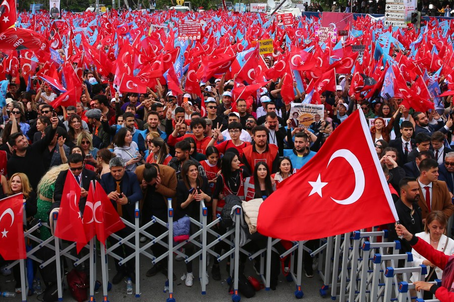 Supporters of Turkish CHP party leader and Nation Alliance's presidential candidate Kemal Kilicdaroglu wave Turkish flags during an election campaign rally in Ankara, Turkey, Friday, May 12, 2023. Turkey is heading toward presidential and parliamentary elections on Sunday. (AP Photo/Ali Unal)