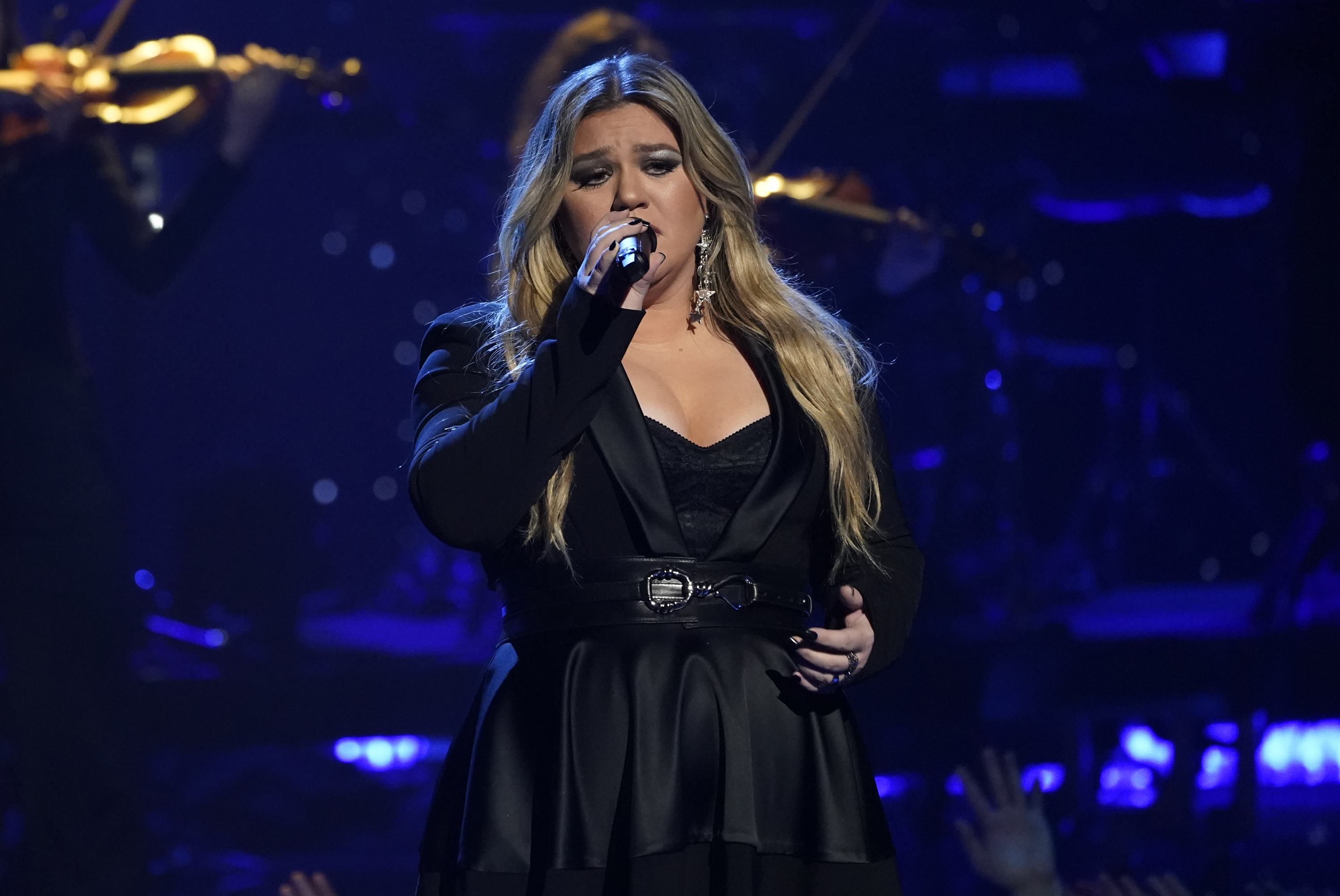 FILE - Kelly Clarkson performs during a tribute to Icon award winner Pink at the iHeartRadio Music Awards on Monday, March 27, 2023, at the Dolby Theatre in Los Angeles. Clarkson has responded, Saturday, May 13, to a Rolling Stone report accusing her daytime talk show of being a toxic workplace. She addressed the allegations after 11 current and former employees complained about being overworked and underpaid on “The Kelly Clarkson Show” in which they also called “traumatizing to their mental health” in the magazine’s Friday report. (AP Photo/Chris Pizzello, File)