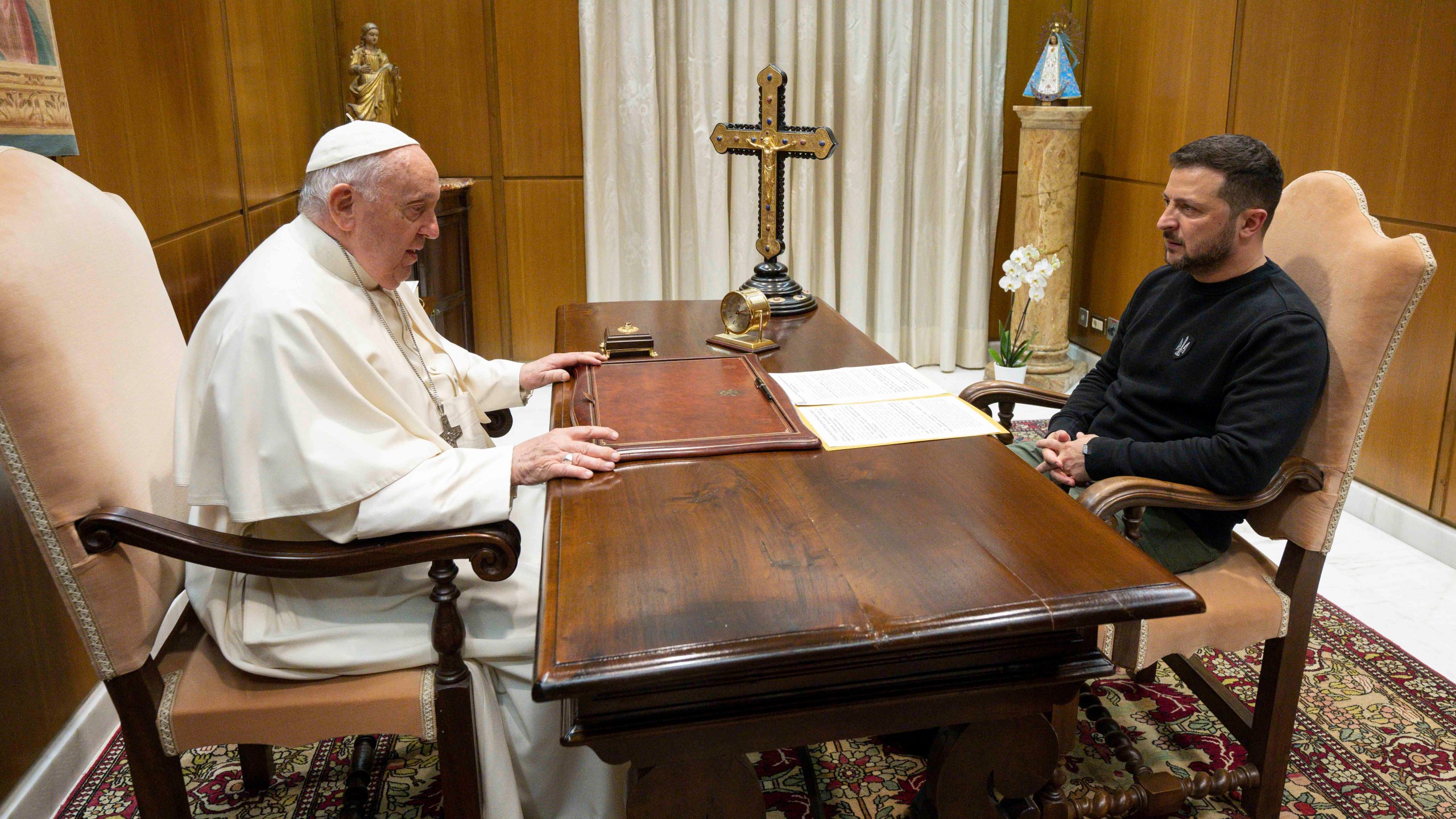 This image made available by Vatican News shows Pope Francis meeting Ukrainian President Volodymyr Zelenskyy during a private audience at The Vatican, Saturday, May 13, 2023. Francis recently said that the Vatican has launched a behind-the-scenes initiative to try to end the war launched last year by Russia. (Vatican News via AP)