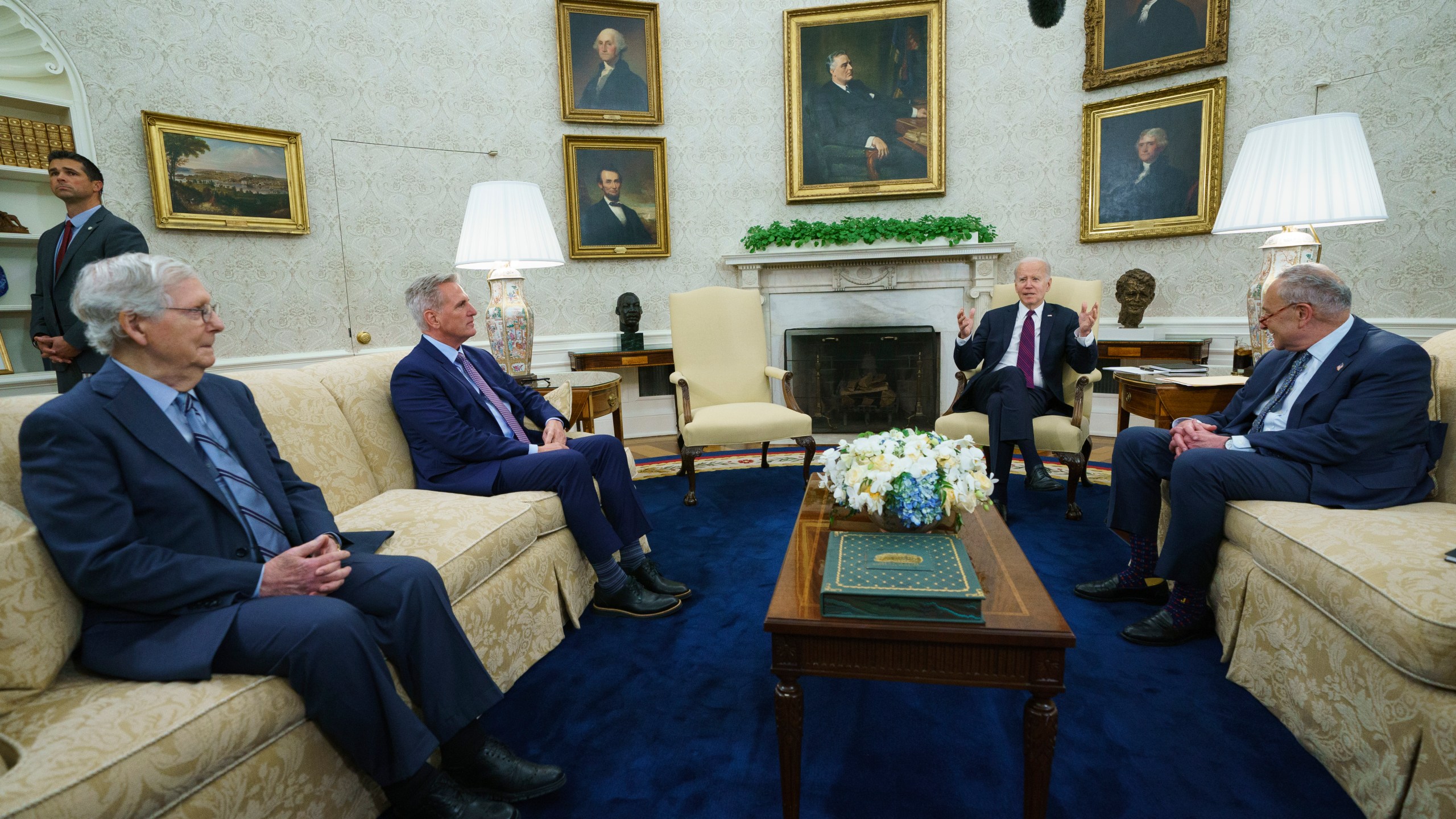 FILE - Senate Minority Leader Mitch McConnell of Ky., Speaker of the House Kevin McCarthy of Calif., and Senate Majority Leader Sen. Chuck Schumer of N.Y., listen as President Joe Biden speaks before a meeting to discuss the debt limit in the Oval Office of the White House, Tuesday, May 9, 2023, in Washington. (AP Photo/Evan Vucci, File)