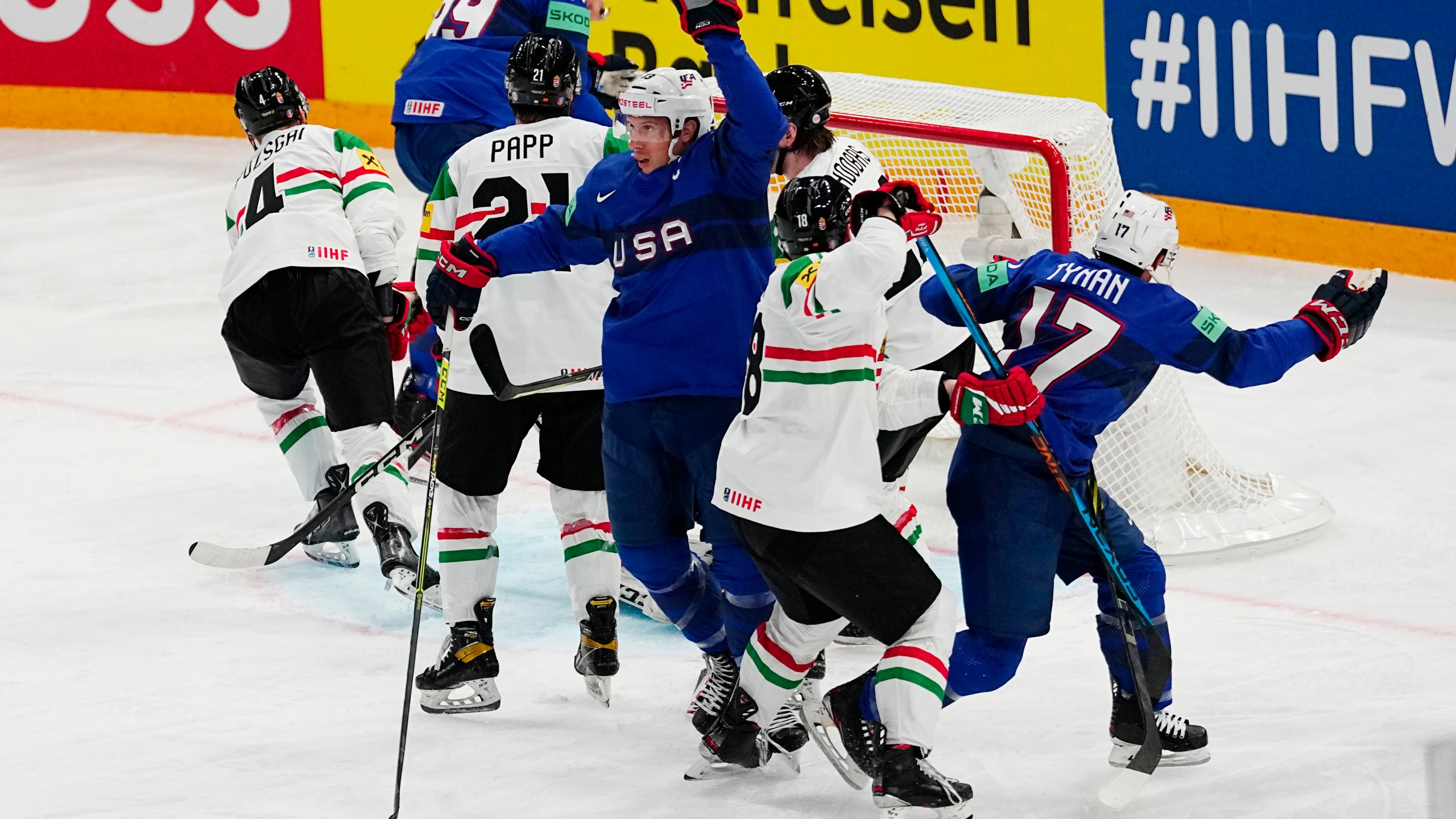 United States Nick Bonino, centre, celebrates after scoring his side's third goal during the group A match between United States and Hungary at the ice hockey world championship in Tampere, Finland, Sunday, May 14, 2023. (AP Photo/Pavel Golovkin)