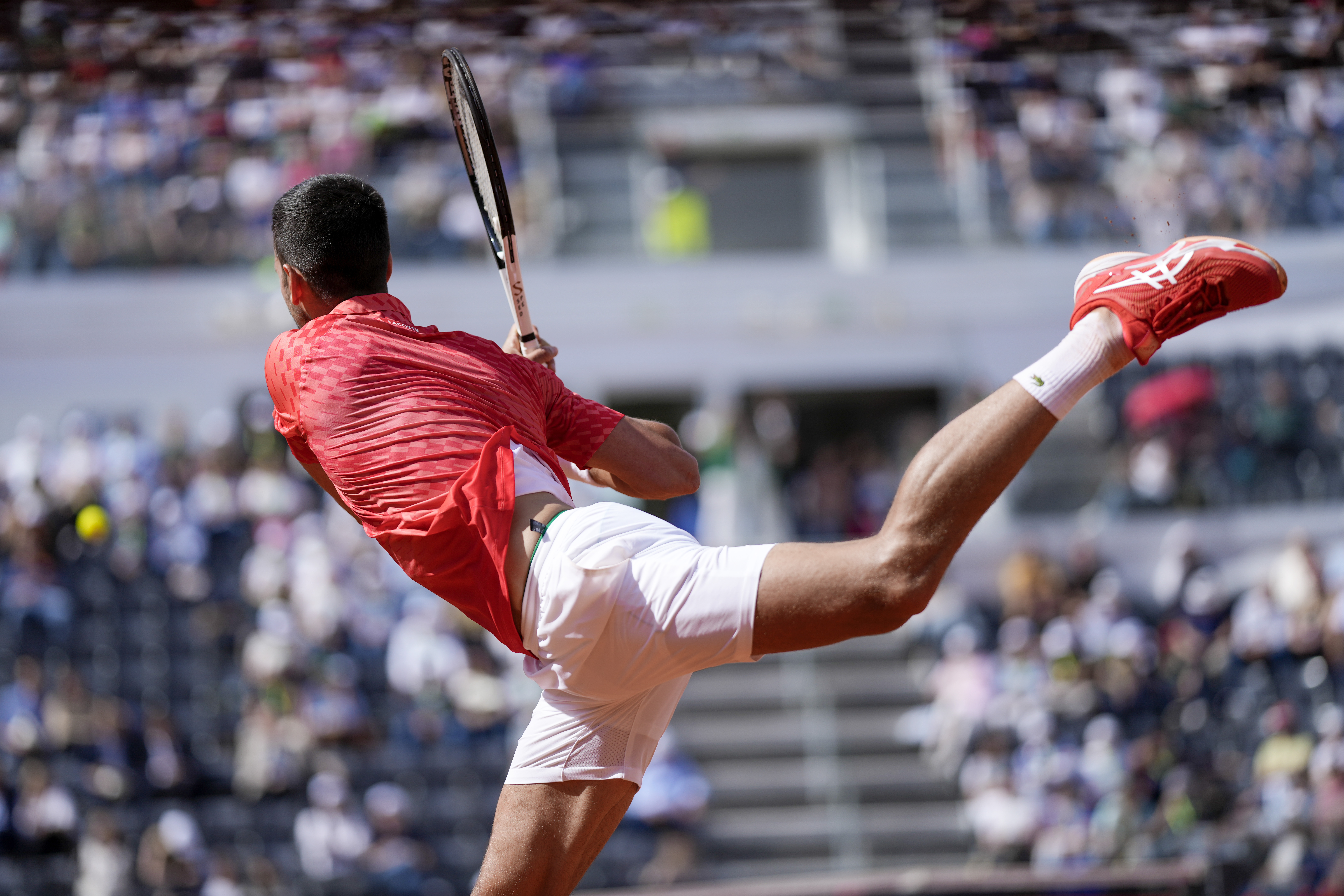 Novak Djocovic returns the ball to Grigor Dimitrov at the Italian Open tennis tournament, in Rome, Sunday, May 14, 2023. (AP Photo/Andrew Medichini)