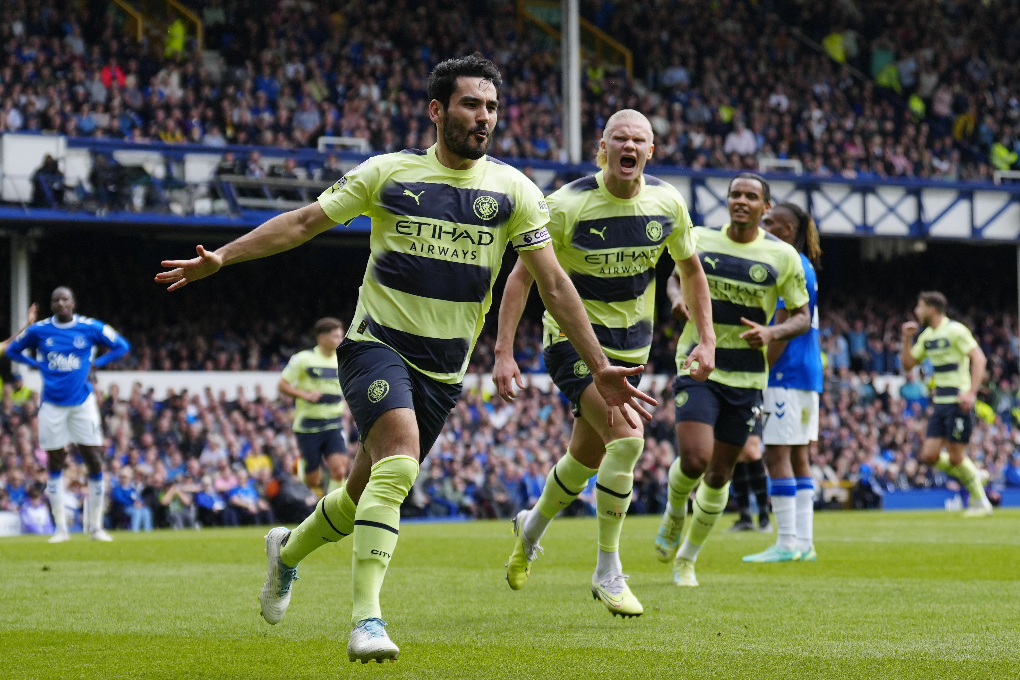 Manchester City's Ilkay Gundogan celebrates after scoring his side's opening goal during the English Premier League soccer match between Everton and Manchester City at the Goodison Park stadium in Liverpool, England, Sunday, May 14, 2023. (AP Photo/Jon Super)