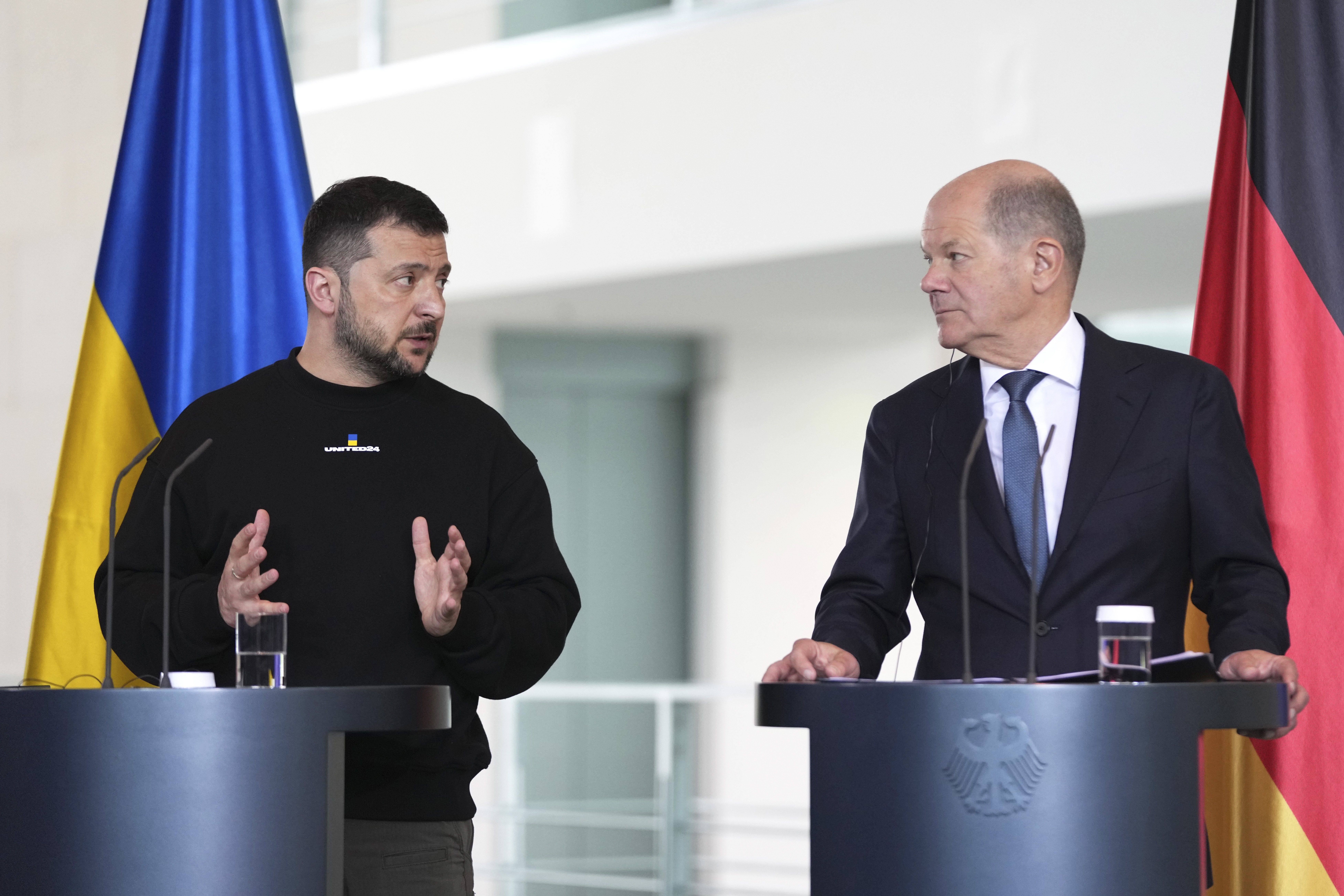 Germany's Chancellor Olaf Scholz, rigth, and Ukraine's President Volodymyr Zelenskyy address a media conference at the chancellery in Berlin, Germany, Sunday, May 14, 2023. Ukrainian President Volodymyr Zelenskyy arrived in Berlin early Sunday for talks with German leaders about further arms deliveries to help his country fend off the Russian invasion and rebuild what's been destroyed by more than a year of devastating conflict. (AP Photo/Matthias Schrader)