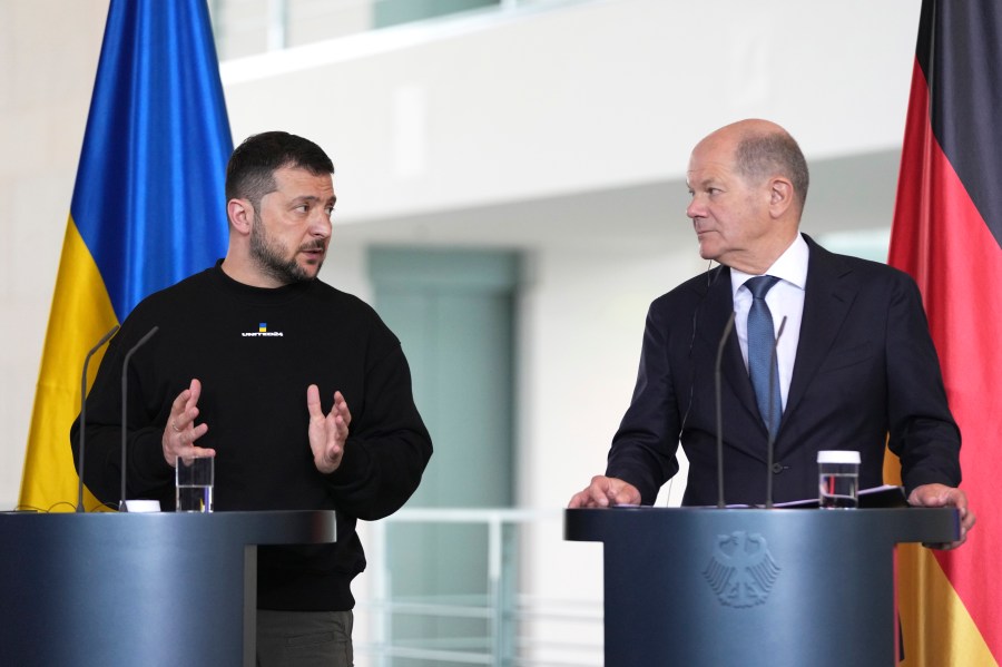 Germany's Chancellor Olaf Scholz, rigth, and Ukraine's President Volodymyr Zelenskyy address a media conference at the chancellery in Berlin, Germany, Sunday, May 14, 2023. Ukrainian President Volodymyr Zelenskyy arrived in Berlin early Sunday for talks with German leaders about further arms deliveries to help his country fend off the Russian invasion and rebuild what's been destroyed by more than a year of devastating conflict. (AP Photo/Matthias Schrader)