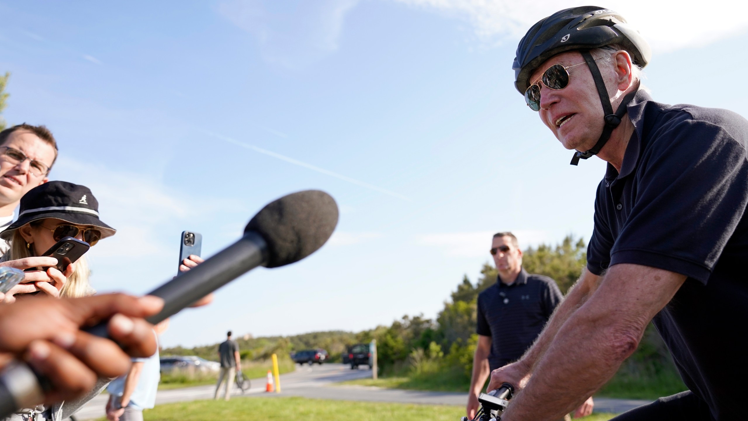 President Joe Biden speaks to members of the media as he goes on a bike ride in Gordons Pond State Park in Rehoboth Beach, Del., Sunday, May 14, 2023. (AP Photo/Carolyn Kaster)