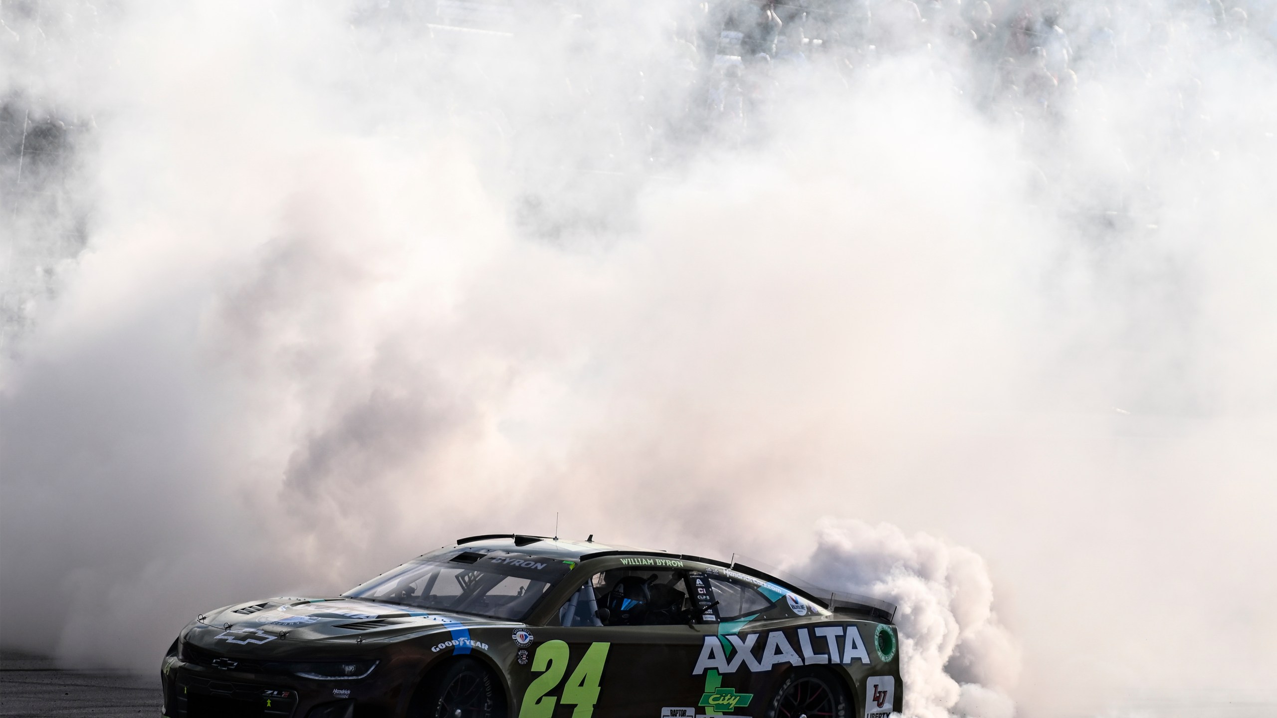 William Byron (24) does a burnout after winning a NASCAR Cup Series auto race at Darlington Raceway, Sunday, May 14, 2023, in Darlington, S.C. (AP Photo/Matt Kelley)