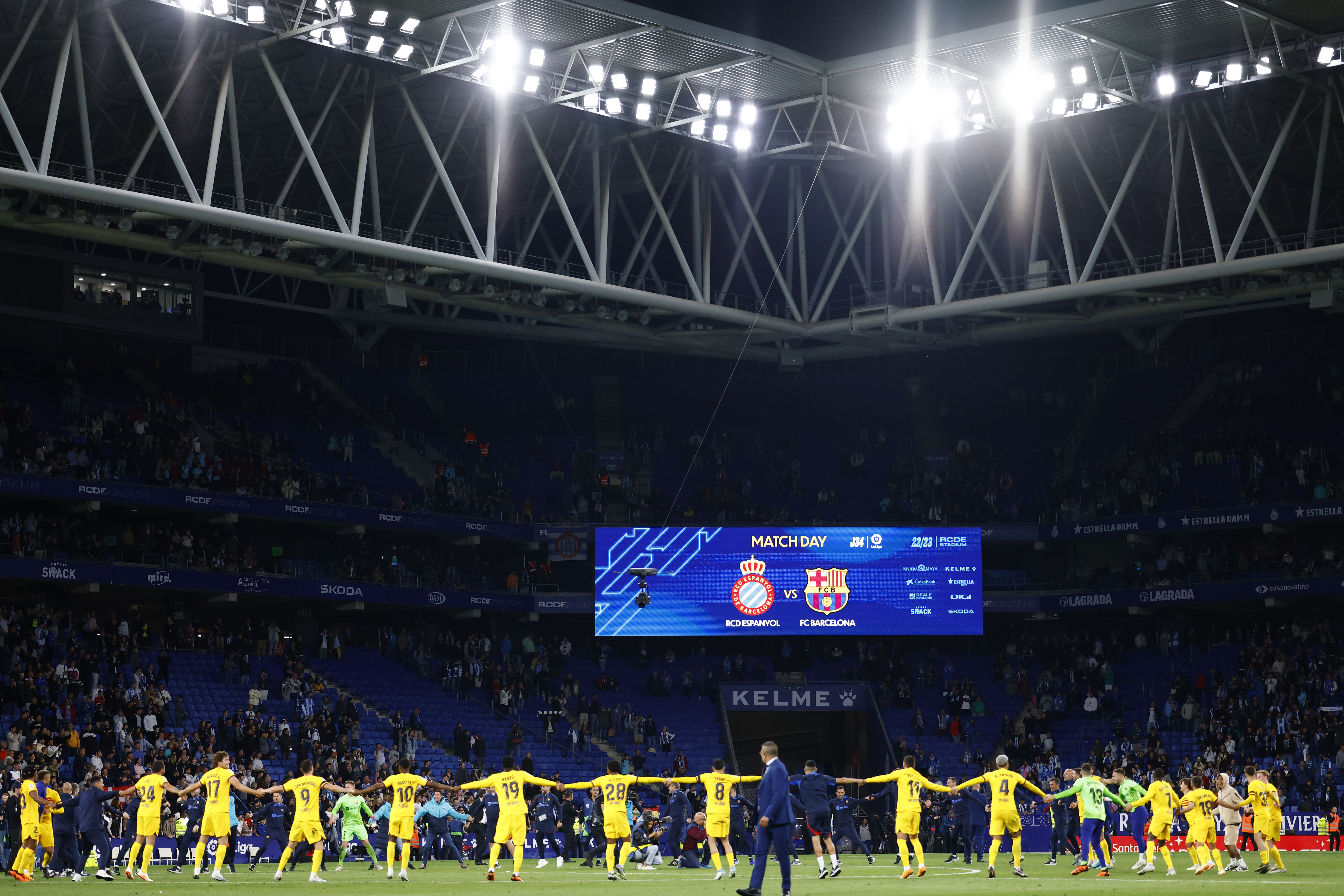 Barcelona players celebrate after the Spanish La Liga soccer match between Espanyol and Barcelona at the RCDE stadium in Barcelona, Sunday, May 14, 2023. (AP Photo/Joan Monfort)