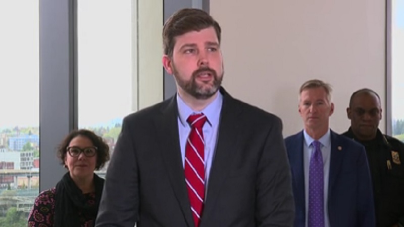 Multnomah County DA Mike Schmidt at a press conference. Behind him is Multnomah County Chair Jessica Vega Pederson and Mayor Ted Wheeler, May 1, 2023 (KOIN)