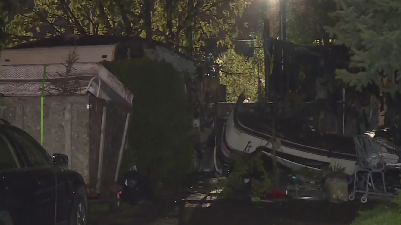 4 people suffered burns when an RV caught fire and spread to a nearby trailer in SE Portland on Tuesday, May 2, 2023